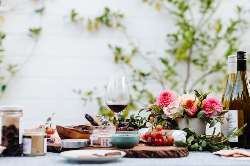 santa barbara company products being enjoyed on a table in an outdoor setting